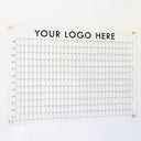a yearly calendar with a custom logo on clear acrylic